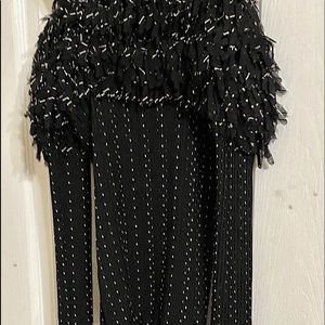 Black strap shirt with feather layers on top